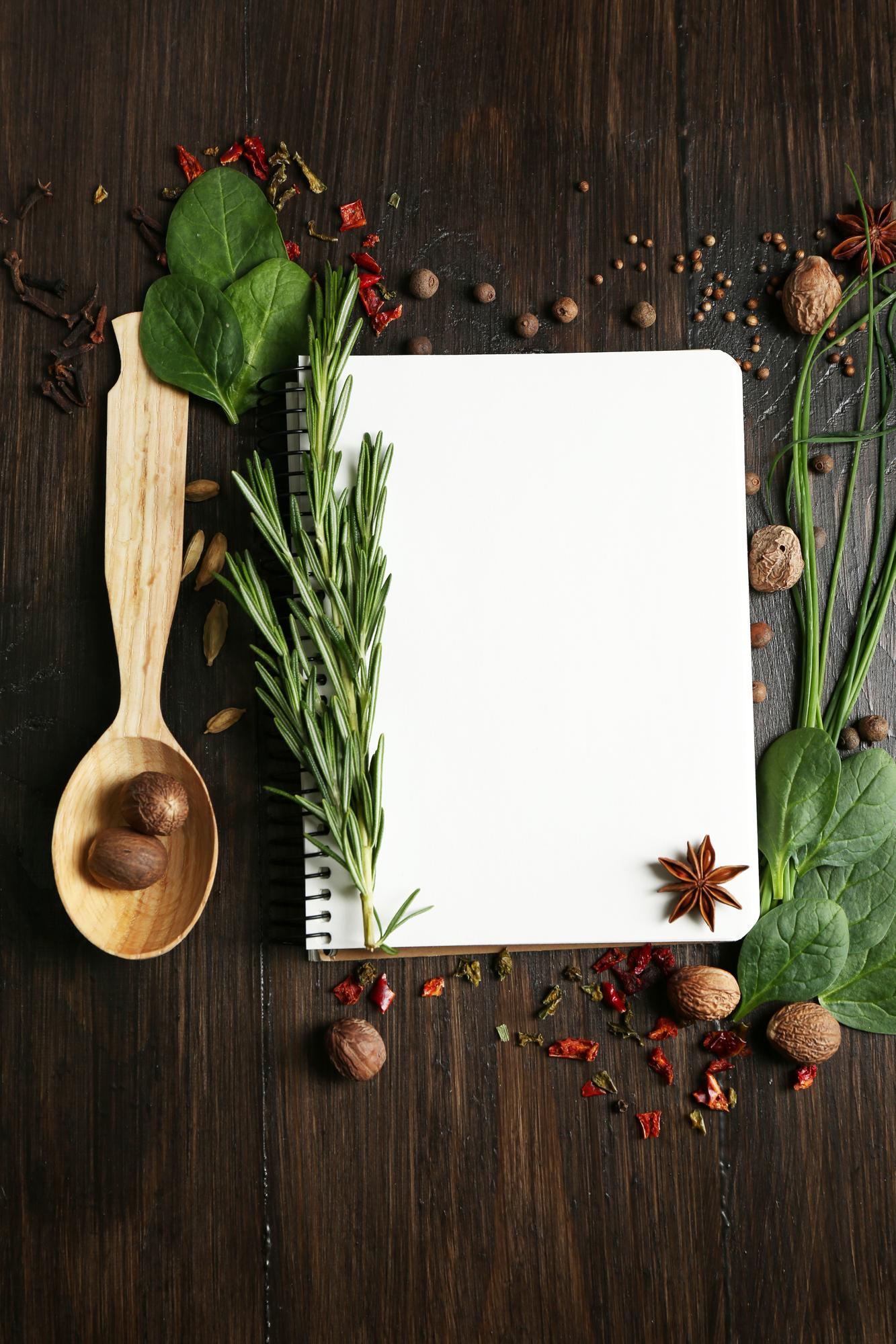 Flatlay of recipe cards and herbs